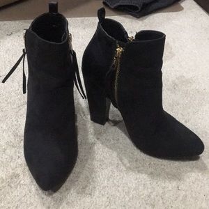 Heeled black booties